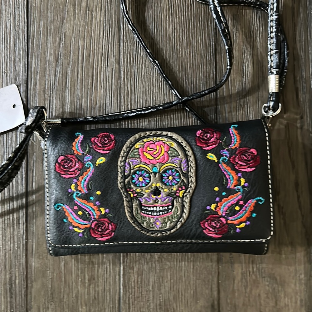 Embroidered Wrist clutch, beautifully designed with roses and sugar skull.
